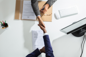 business people shaking hands in agreement | Convertibill®